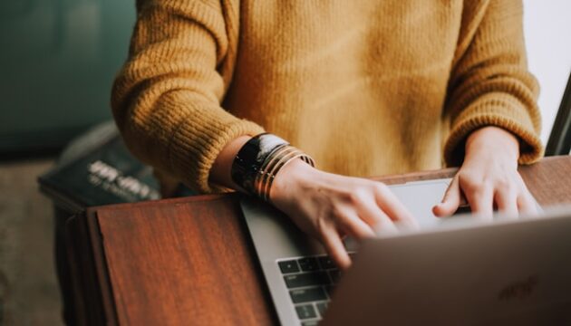 person playing online casino on laptop