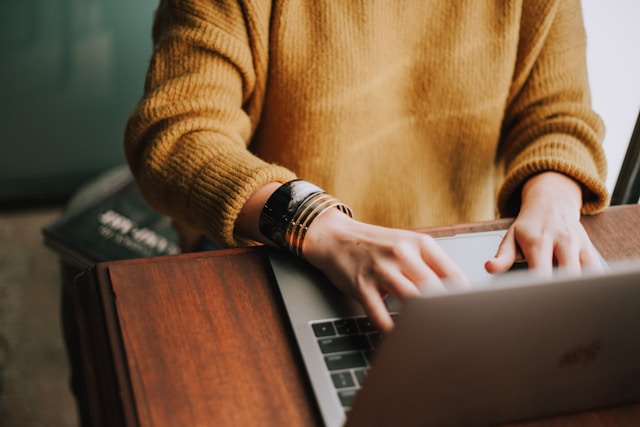 person playing online casino on laptop